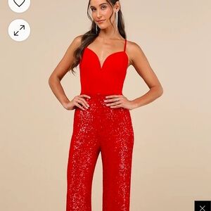 Vibrant Red Wide-Leg Jumpsuit with Plunging Neckline and Fitted Waist